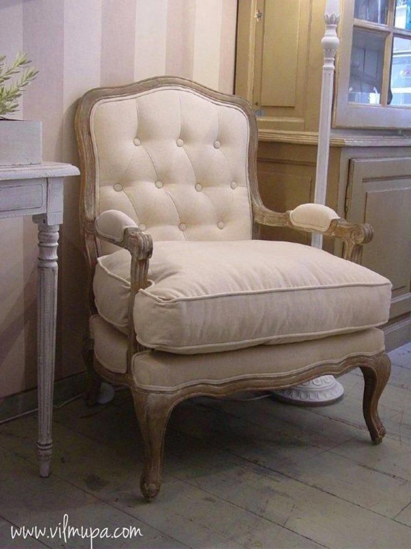sillón tapizado capitone